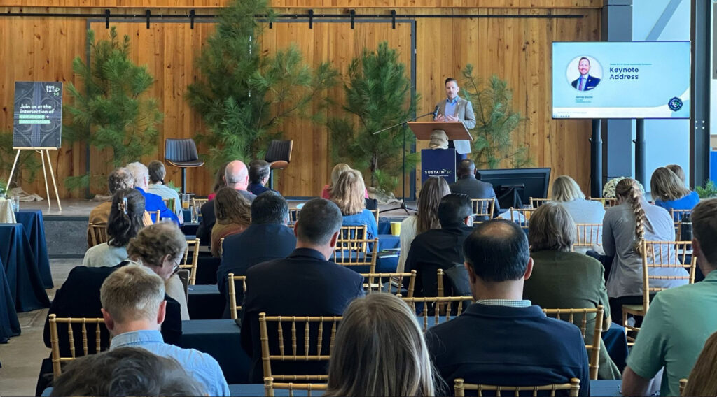 James Dozier presenting a keynote at a conference in Maine